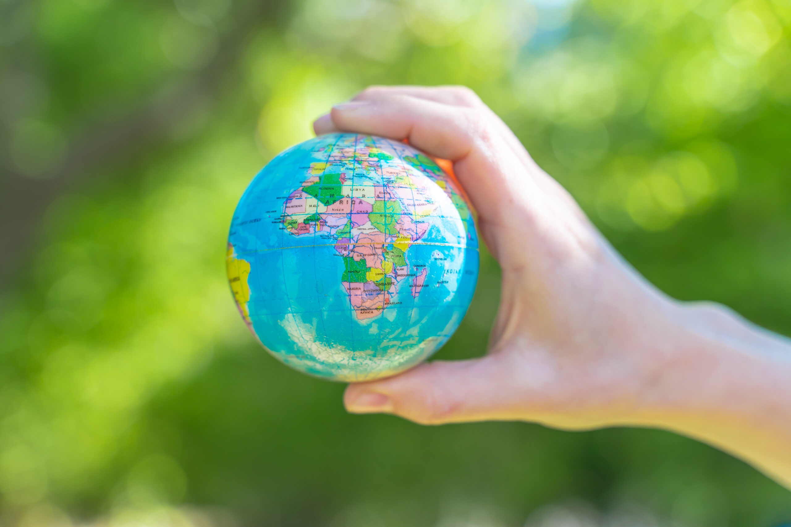 Human hands holding global earth ball. Sustain earth concept. Love nature. Save the planet.